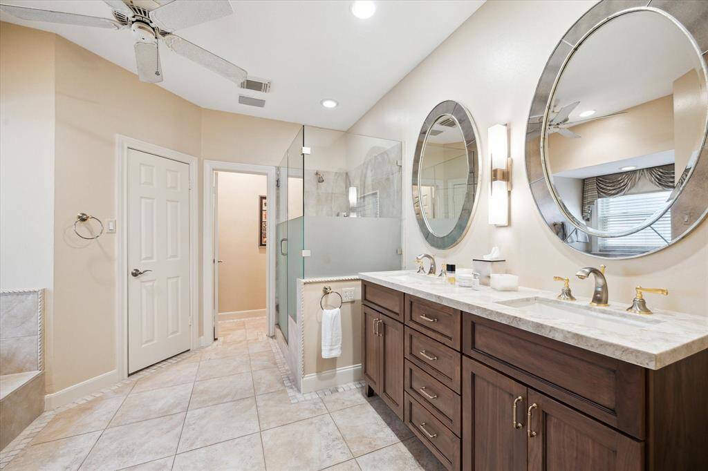 Primary bath with updated, double vanity, separate shower & soaking tub.