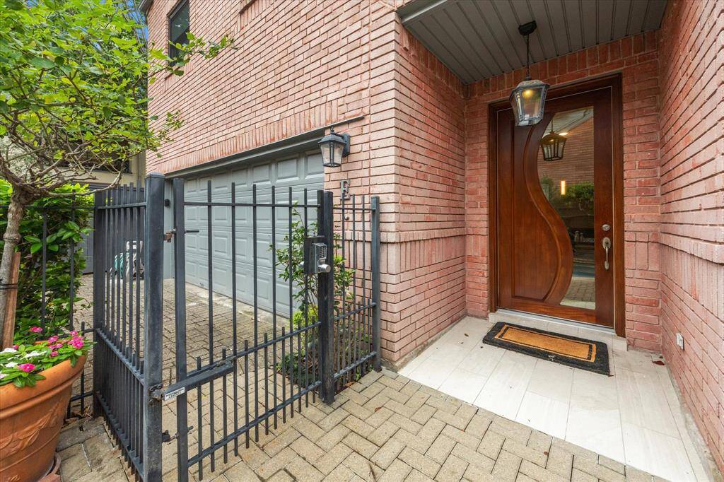 Gated entrance to front door.