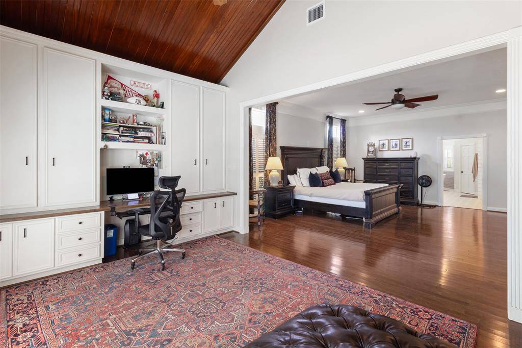 This space is equipped with plenty of cabinets to hide your work when you're finished.
