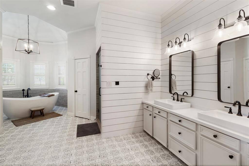 Timeless design blends with farmhouse charm in this stunning bathroom.