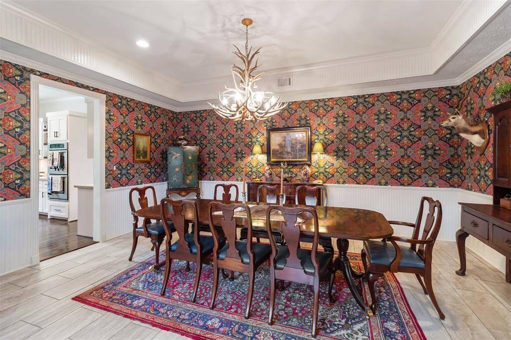 Nestled between the kitchen and living room is the gorgeous dining room.