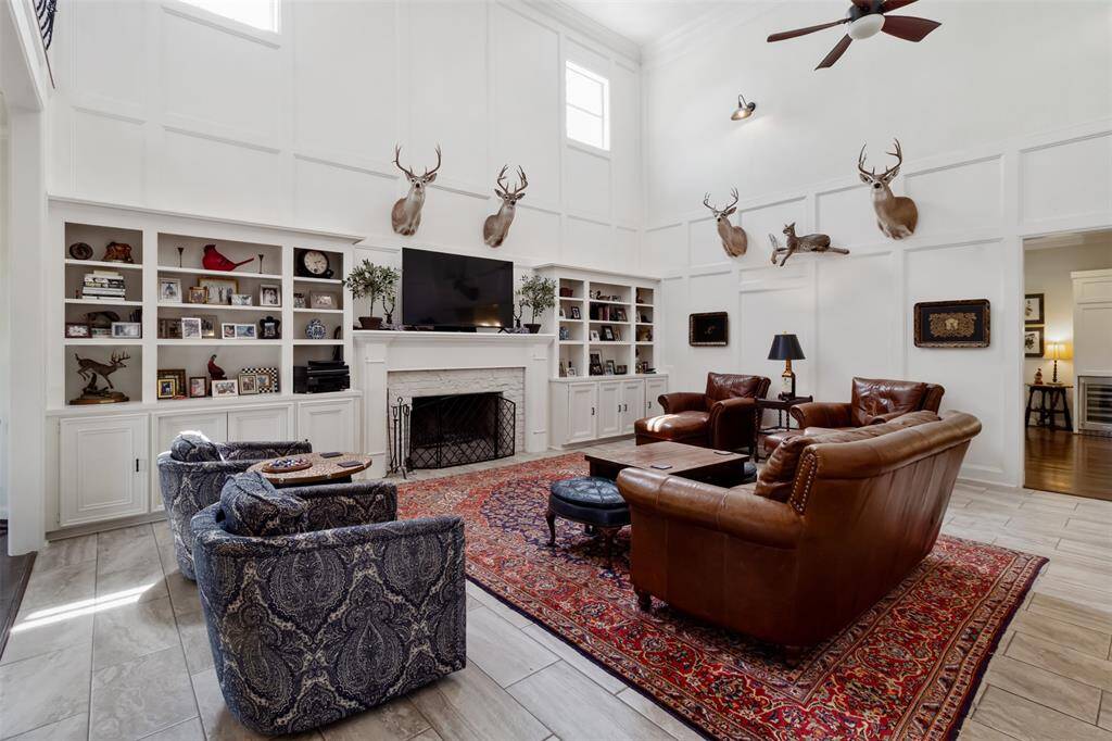 This living room showcases original charm enhanced by modern finishes with custom built-in's.