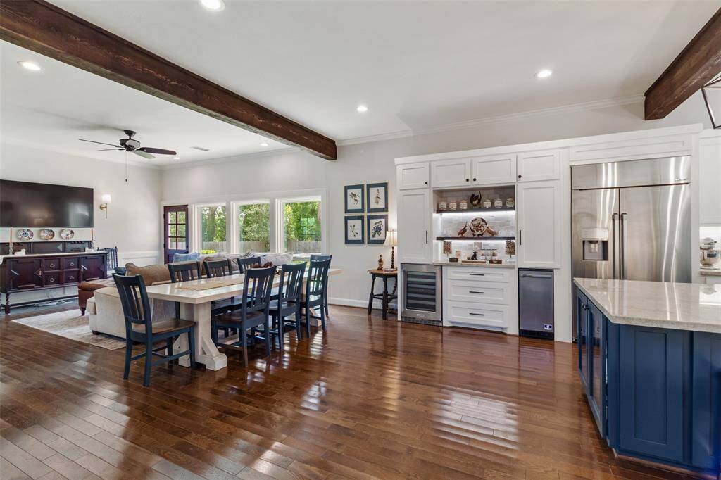 View from the entrance of the living room and your kitchen/breakfast/den combo complete with a coffee nook or wine bar.