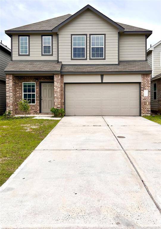 Double driveway, 2 car garage, 3–4-bedroom brick home with nice landscaping and amenities in the neighborhood!