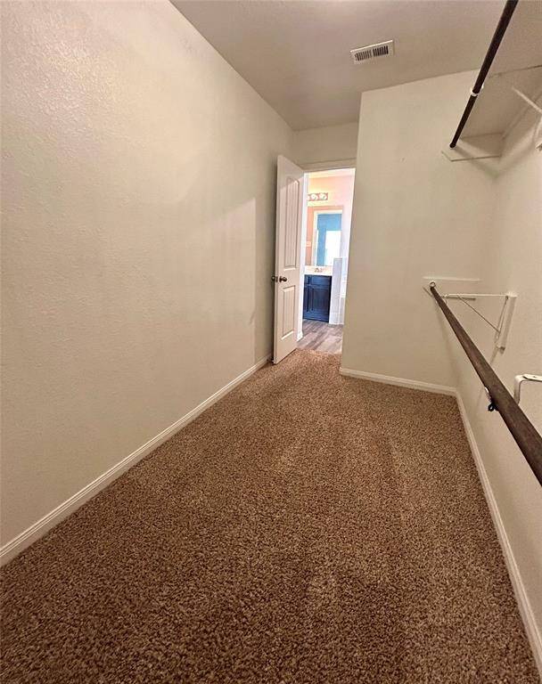Back of primary room walk-in closet view.