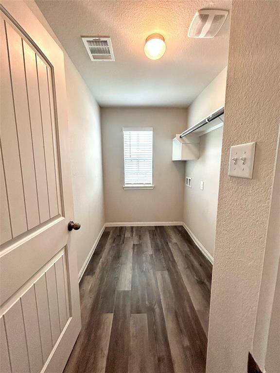 Walk-in utility laundry room located central to 3 bedrooms! Great idea for moms.