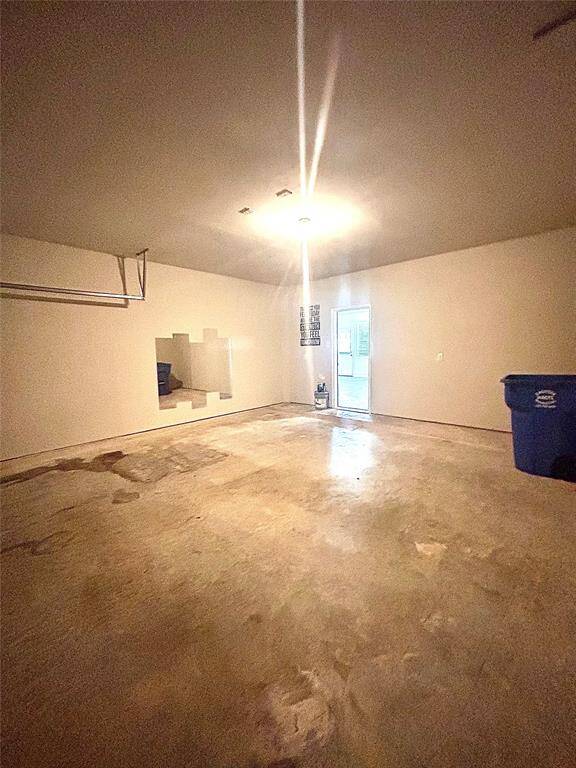 2 car spacious garage with mirrors for your workout goals!