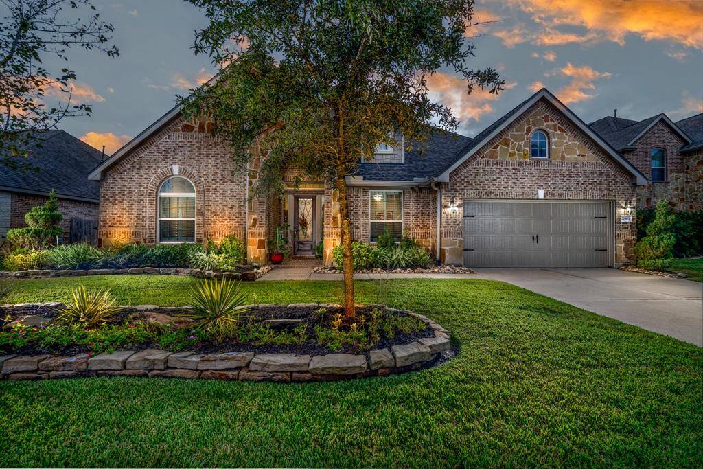 This could be your new home!  Beautiful elevation with lush landscaping and uplighting on a cul-de-sac backing up to one of the neighborhood lakes, fountain, and walking trails!