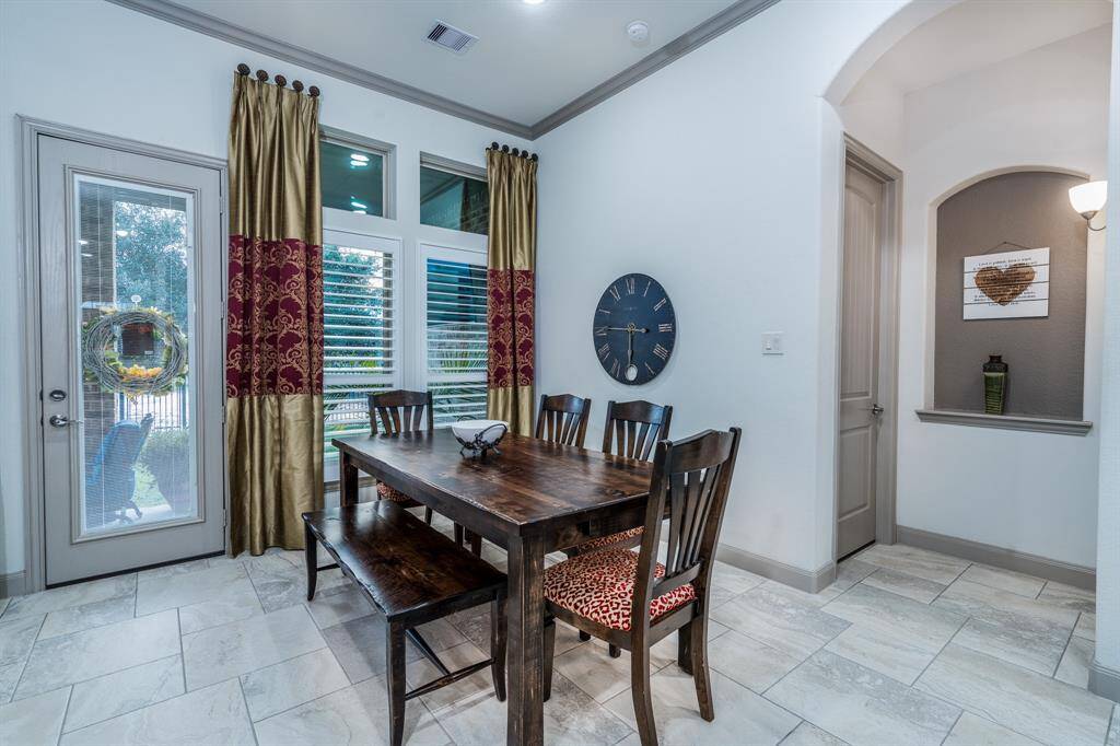 Breakfast area with views of the lake and fountain.  The door to the right leads to the primary bedroom.