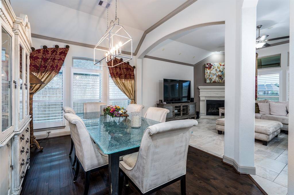 Dining room with 11 foot ceiling, crown molding, and large enough for 6-8 people.