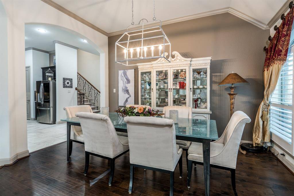 Dining room with 11 foot ceiling, crown molding, and large enough for 6-8 people.