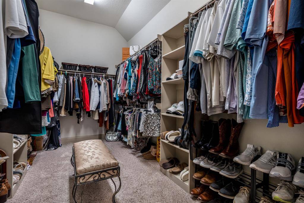 Huge primary closet with built in shelving!