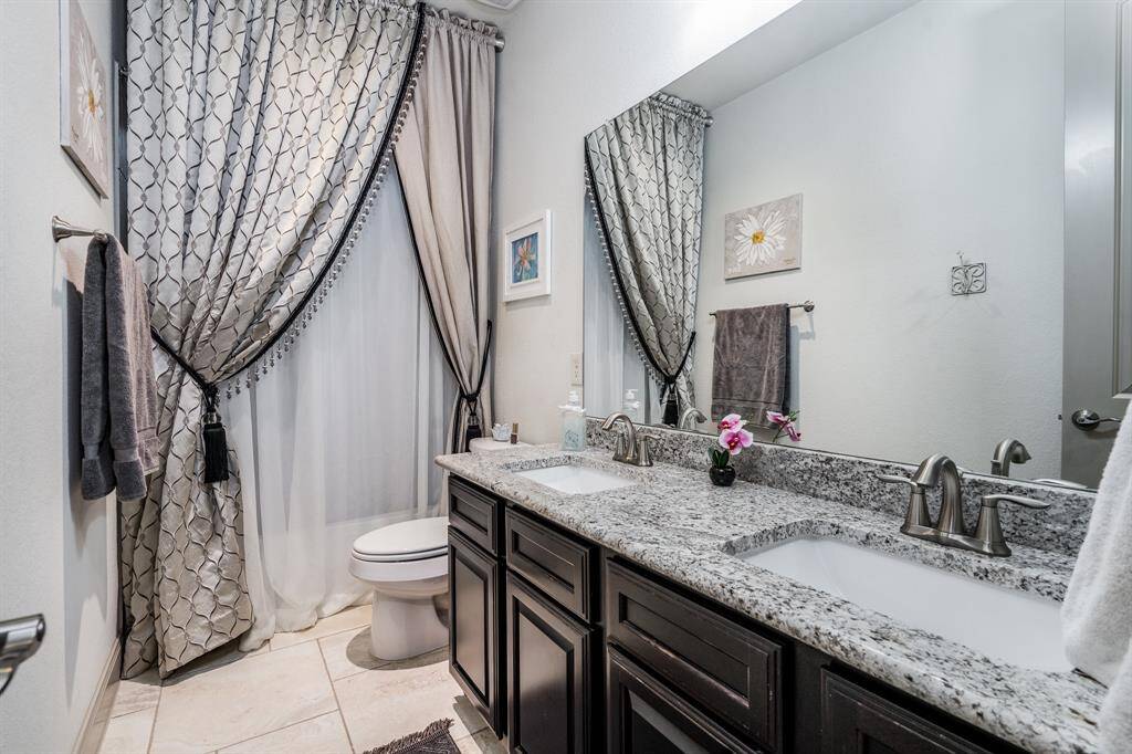 Full bath between bedroom 2 and 3.