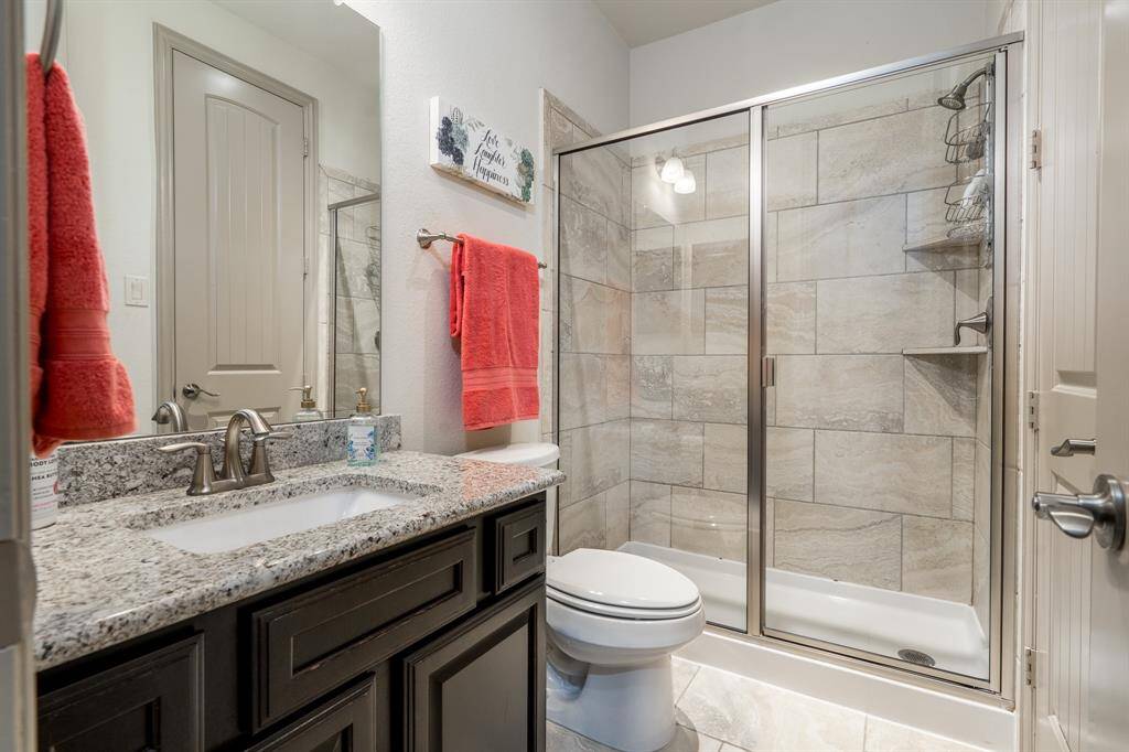 En-Suite full bathroom attached to bedroom 4, with a door that also accesses the hallway.