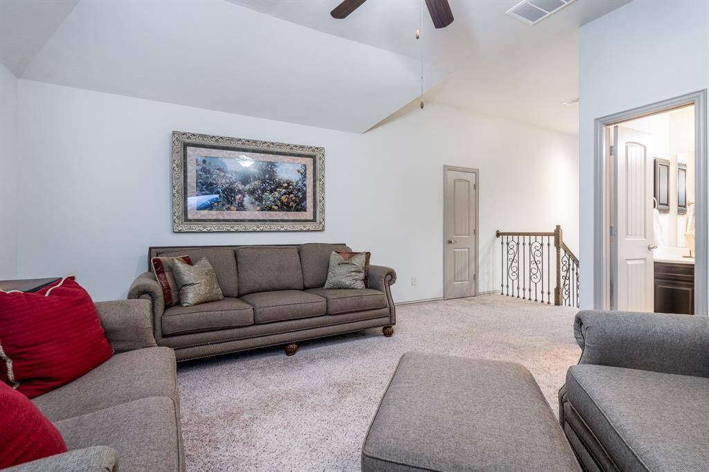 Large upstairs game room with a full bath attached.  The door in the background is another storage closet.