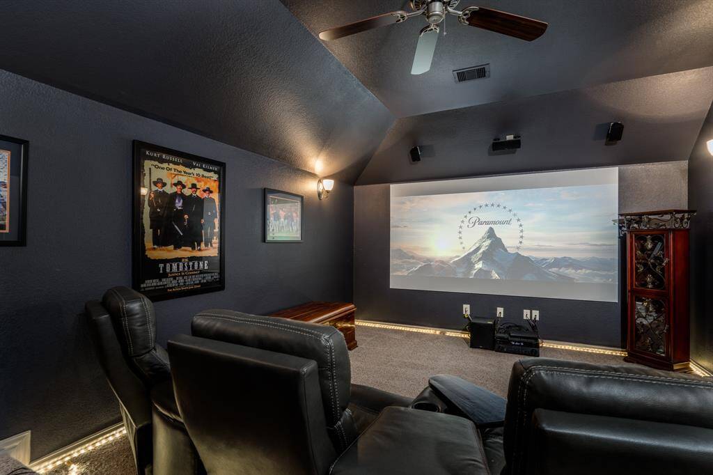 Media room with such a cozy feel!  There's also a full sized door off of this room that leads to the huge floored attic space!