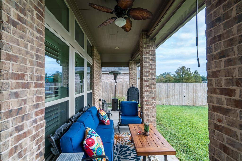 Enjoy sitting on the covered back patio with ceiling fan, mounted TV, and roll down shades.  All windows are double pane, energy efficient, tilt sash for easy cleaning.