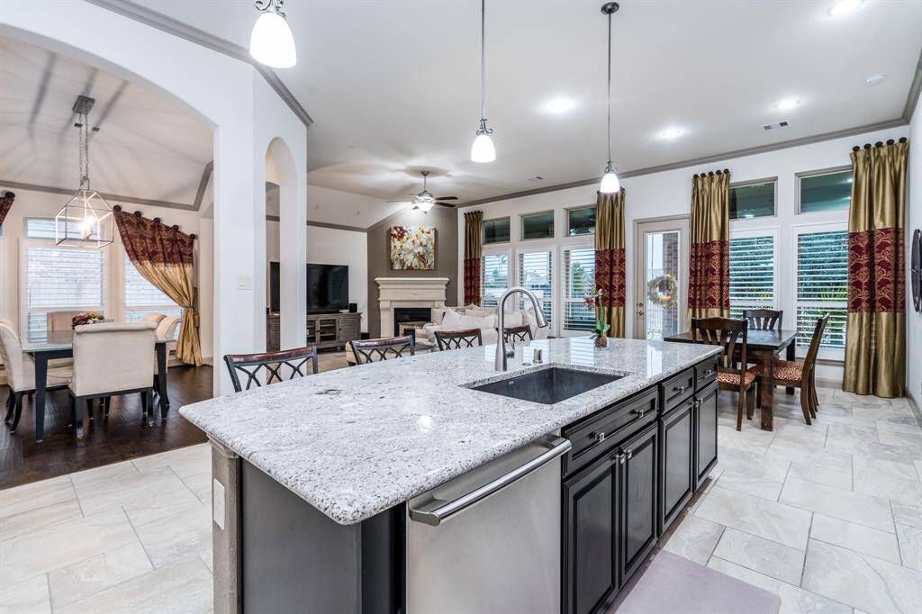 Look at how open this is!  The way it's set up now, including the bar, breakfast table, and dining room, there's room for up to 20 people for eating and entertaining!