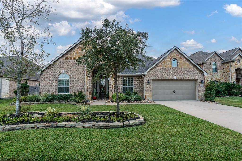 This could be your new home!  Beautiful elevation with lush landscaping and uplighting on a cul-de-sac backing up to one of the neighborhood lakes, fountain, and walking trails!