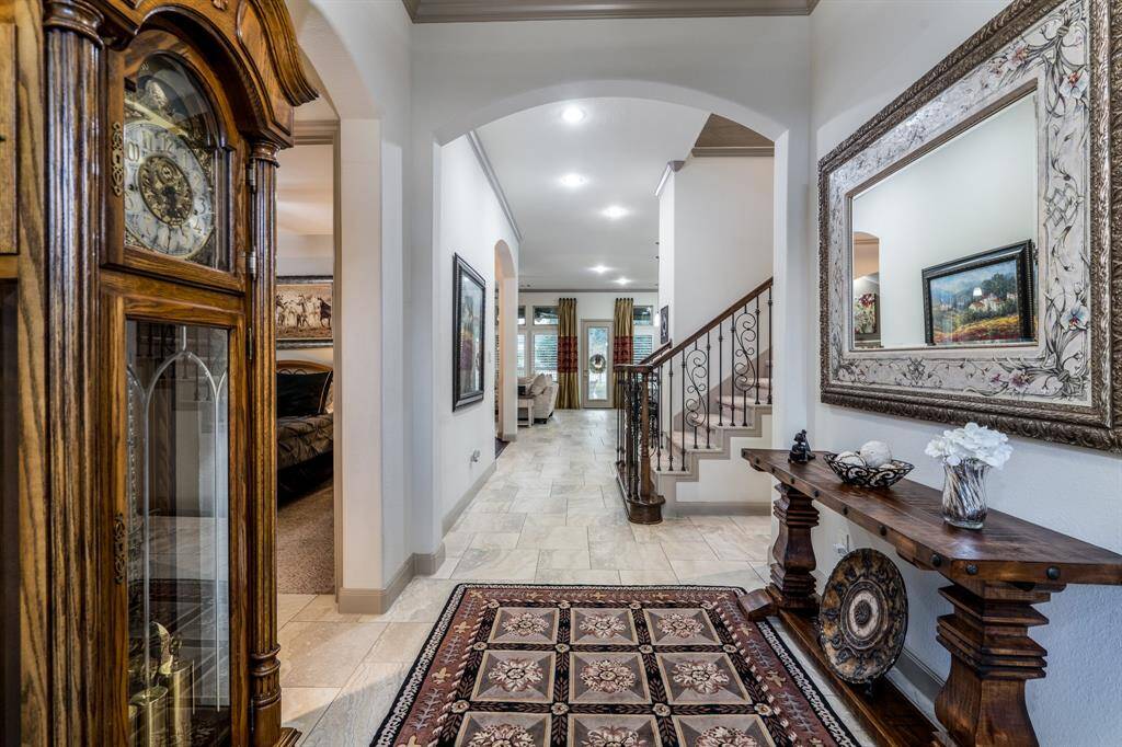 Entering the house, this is your view.  You can see all the way through the house to the lake & fountain in back which is a superb feature of this home.