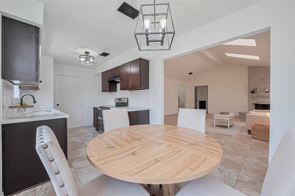 family living with kitchen, dining and living open to each other.
