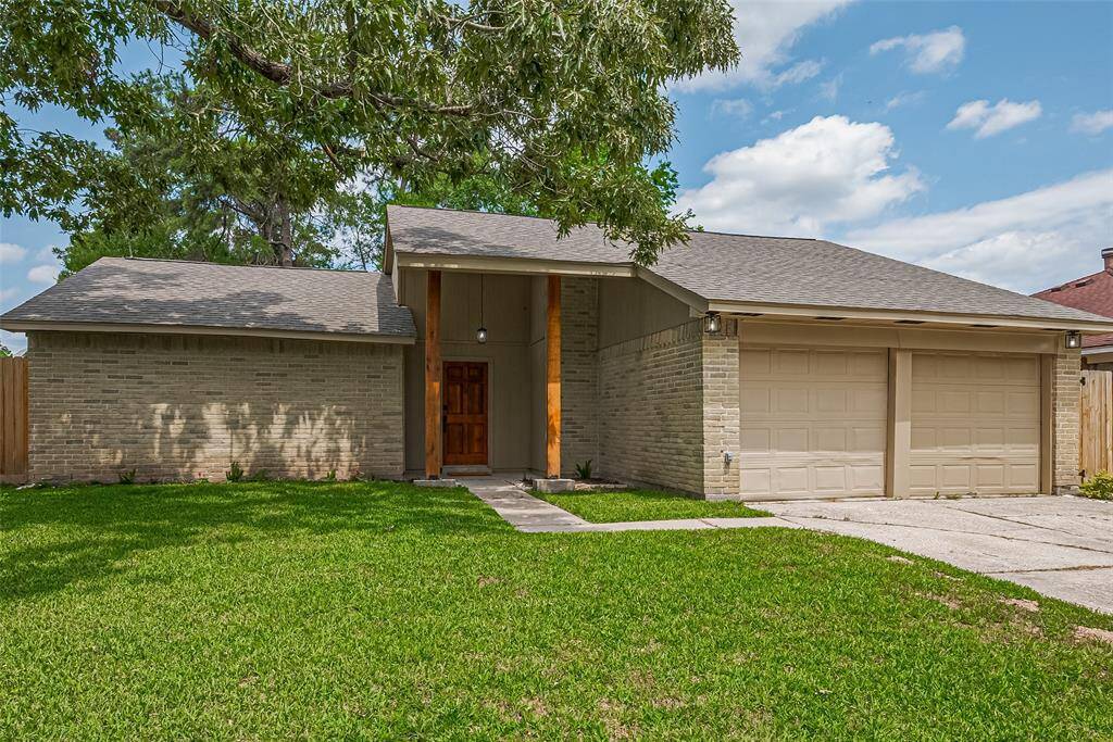 Two car attached garage with double driveway.