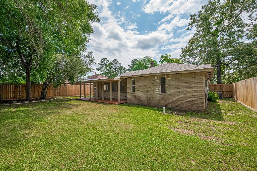 View of the backyard with new fencing and deck.
