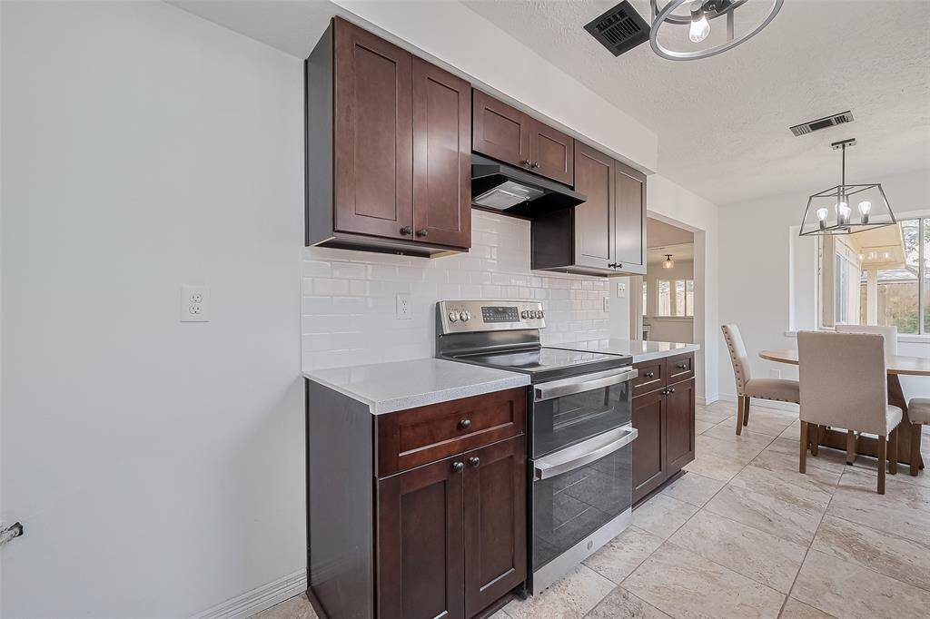 Remodeled kitchen , new stainless and black appliances , cabinets , tile back splash and counters.