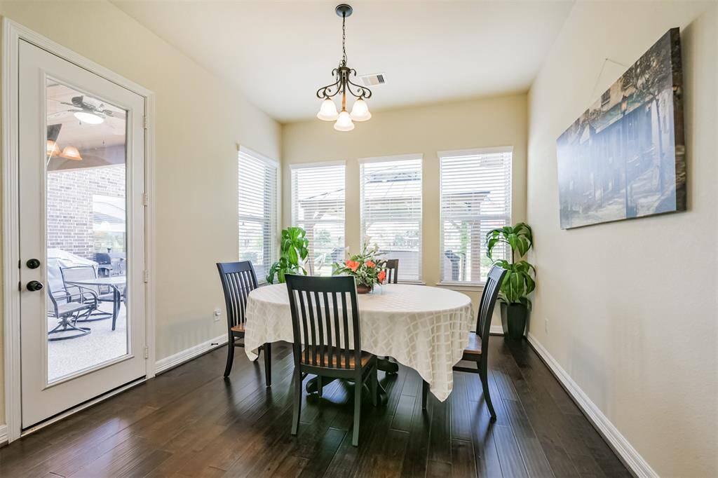 The Kitchen flows into the Breakfast area which also features windows overlooking the patio area.  There is even acess to the patio from the door on the left.
