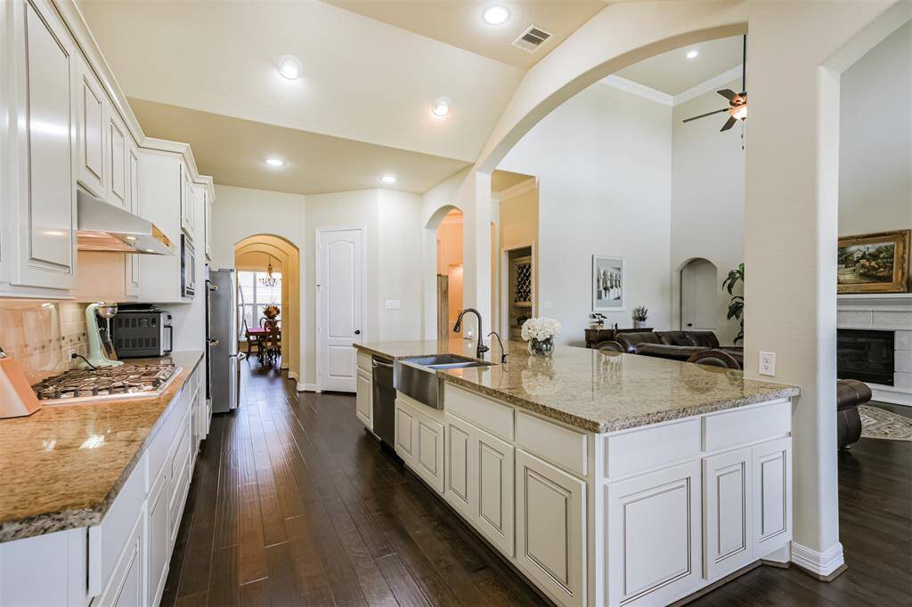 The Kitchen features a huge island which provides ample workspace for preparation and room for your friends and family to pull up a barstool and keep the cook company.