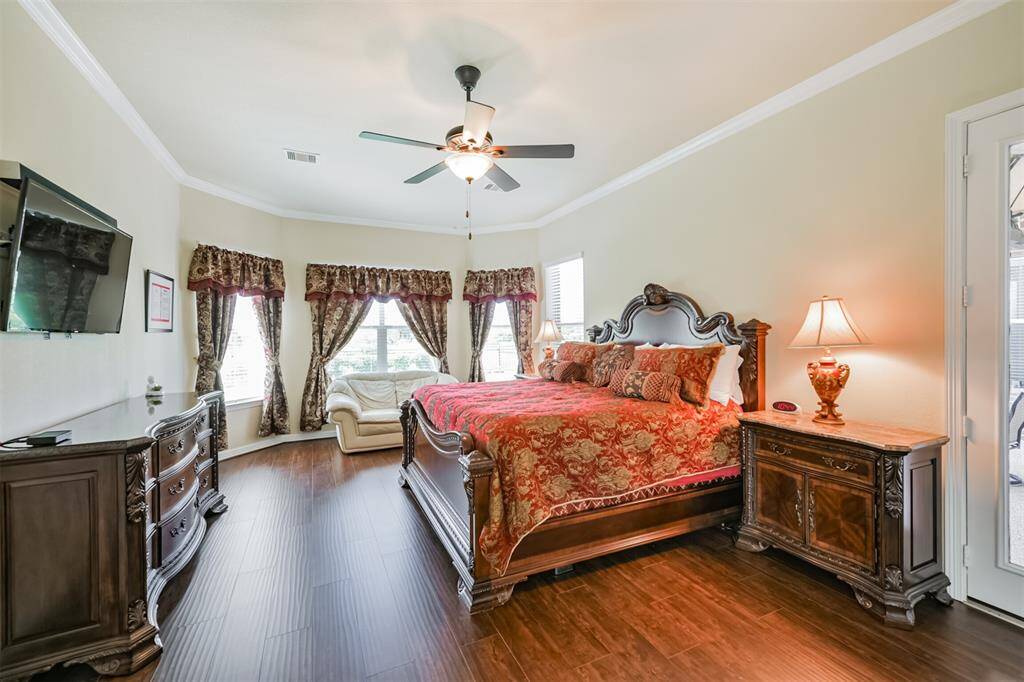 Large Primary bedroom is off the Living Area and features hardwood floors, a beautiful view of the lake and access to the patio and hot tub.