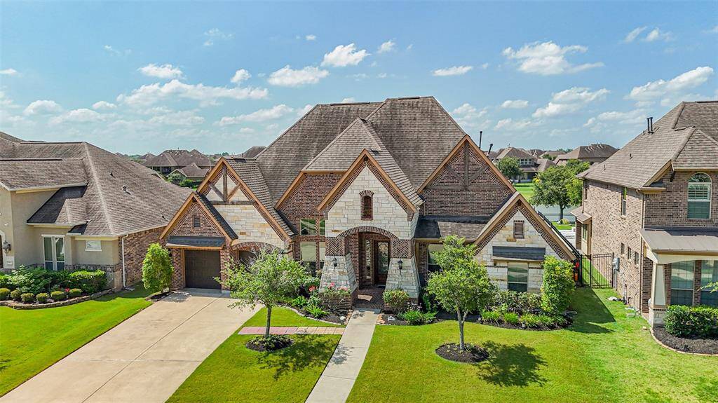 The closer view of the home magnifies the interesting architectural styling and details which continue inside the home as well. Let's step inside!
