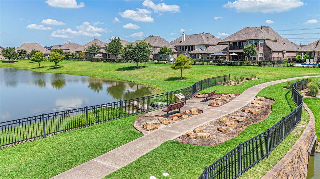 This bridge and sitting area look back at the home and offer a sweeping rear view.  Enjoy walks around the lakes in the neighborhood.  Close enough to enjoy but far enough away not to disturb.