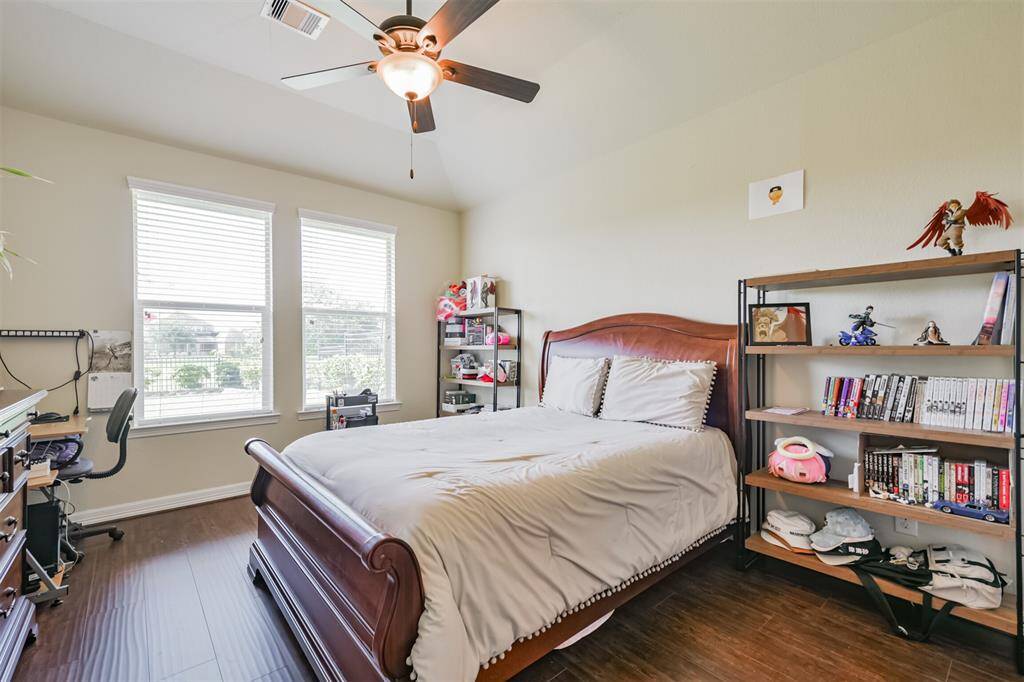 This Bedroom would make a perfect Guest Suite with hardwood floors and an ensuite bath. Located at the rear of the home this room also shares views of the lake.