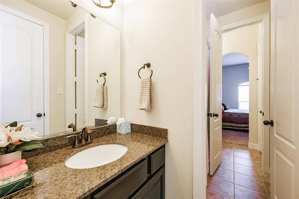The first section of the Hollywood bath with granite counters and under mount sink.