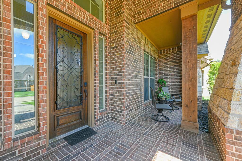 As you approach the home you are welcomed with a cozy covered Front Porch where you can watch the neighborhood activities