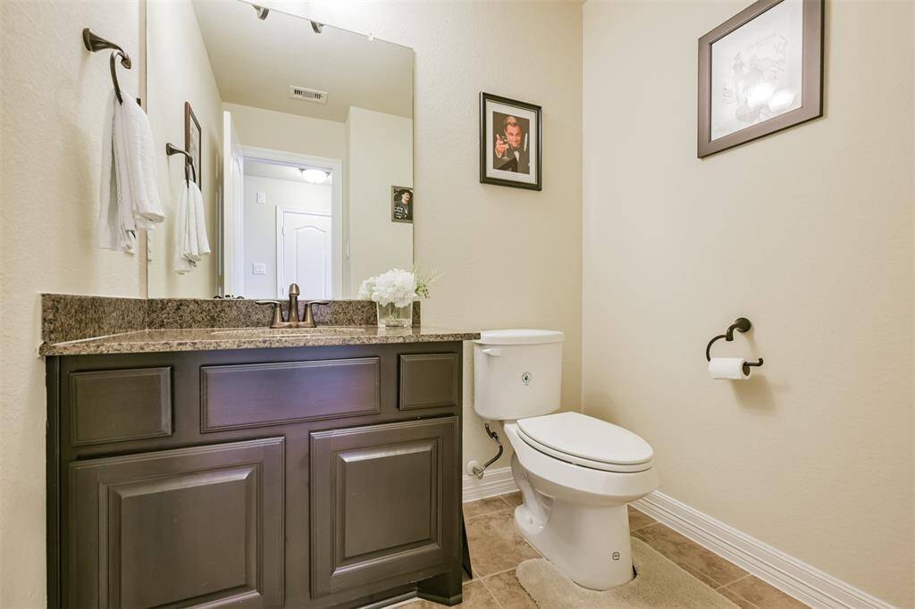 The upstairs area offers a Half Bath for convenience.