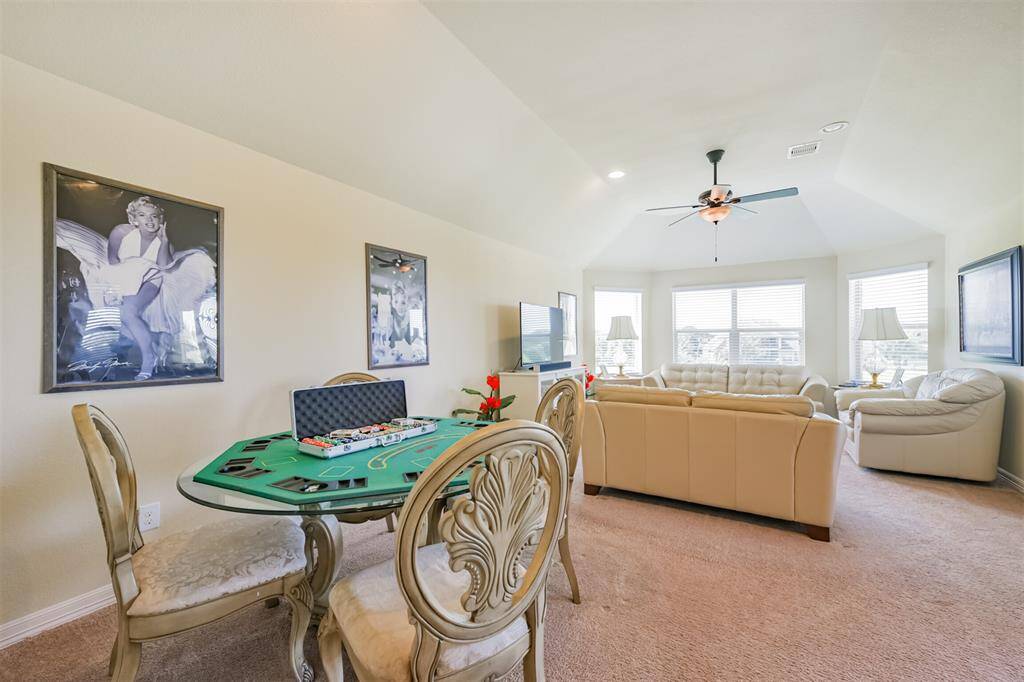 This view of the Game Room shows the size and the windows that provide another view of the lakes and walking trails.
