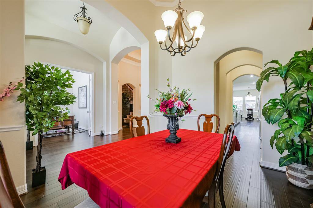 Just across from the Home Office/Study  is the Formal Dining Room.  Notice the arch doorways and the open flow to this floor plan.