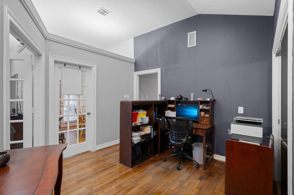 Currently utilized as a home office, this area adjoining the primary bedroom and hallway could be utilized however you see fit. The wall could also be easily removed to expand the bedroom, if so desired.