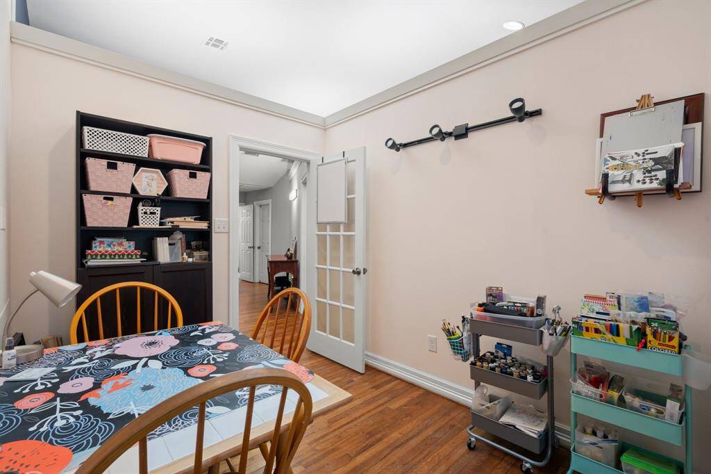 Another view of the well-lit craft or hobby room. A functional and inviting workspace.