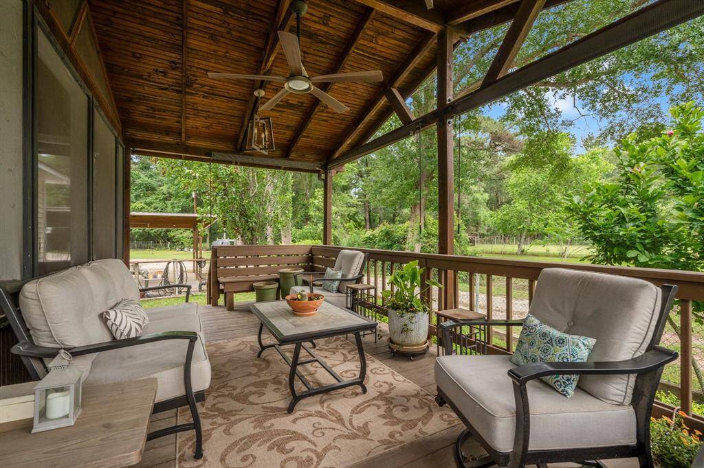Step outside through the screen door and be greeted by lush greenery and views of your property as far as the eye can see!