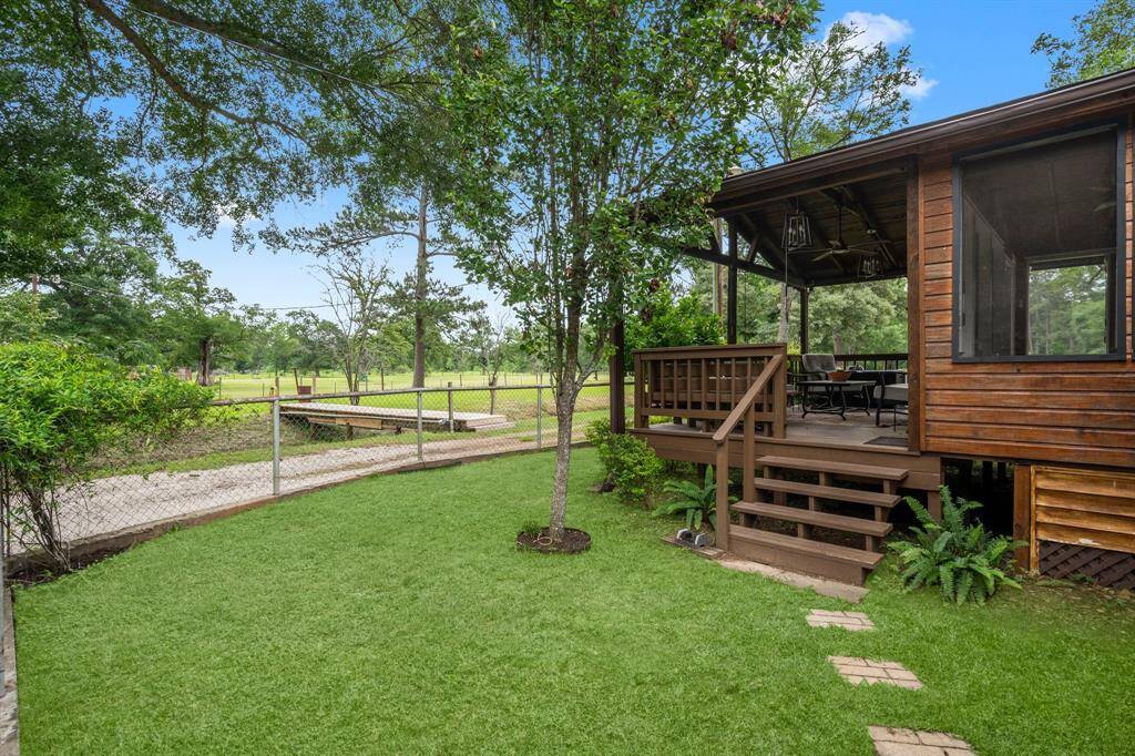 The other side of the covered back patio features a convenient staircase.