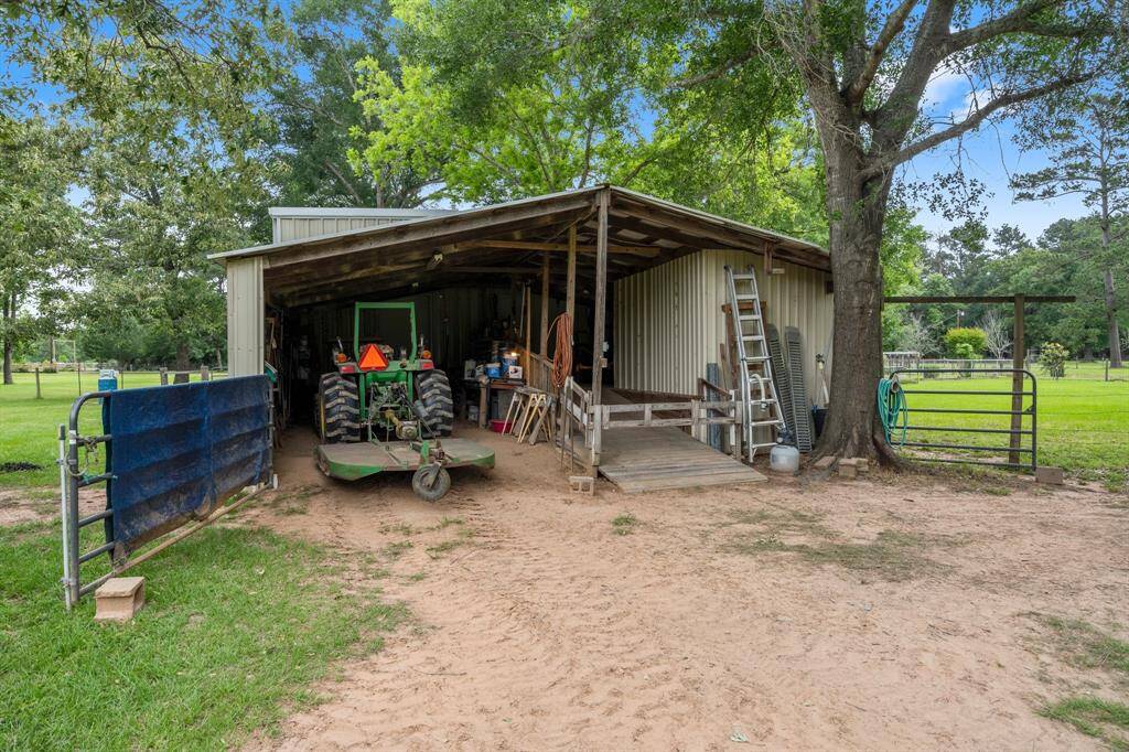 Spacious shed attached to the rear of the shop perfect for storing large equipment, outdoor tools and lumber.