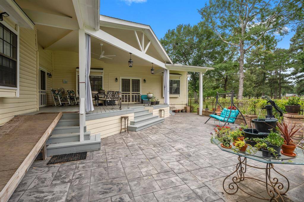 Inviting patio area with a covered porch, ideal for outdoor dining and entertainment.