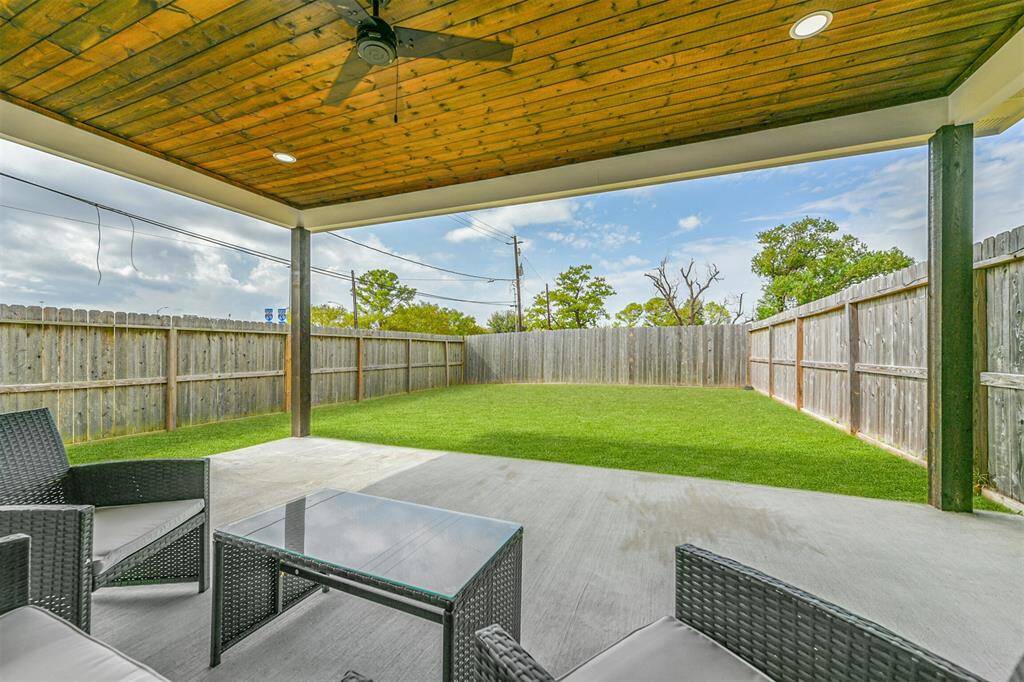 The possiblities are endless with this expansive backyard and covered patio.