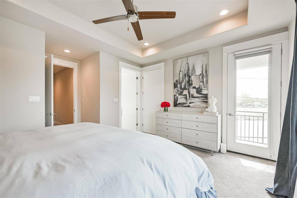 An eight foot door in the primary bedroom gives access to a privatebalcony with unobstructed views of the downtown skyline.