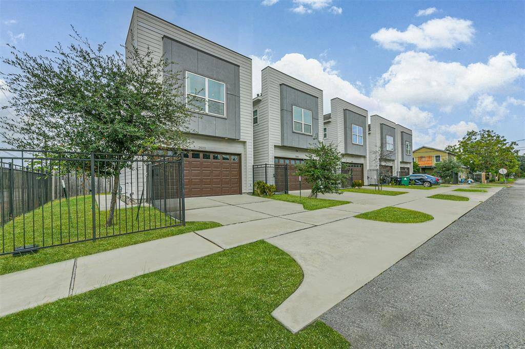 This modern corner lot home features a double driveway and two car garage. It also sits on the largest lot in this development.