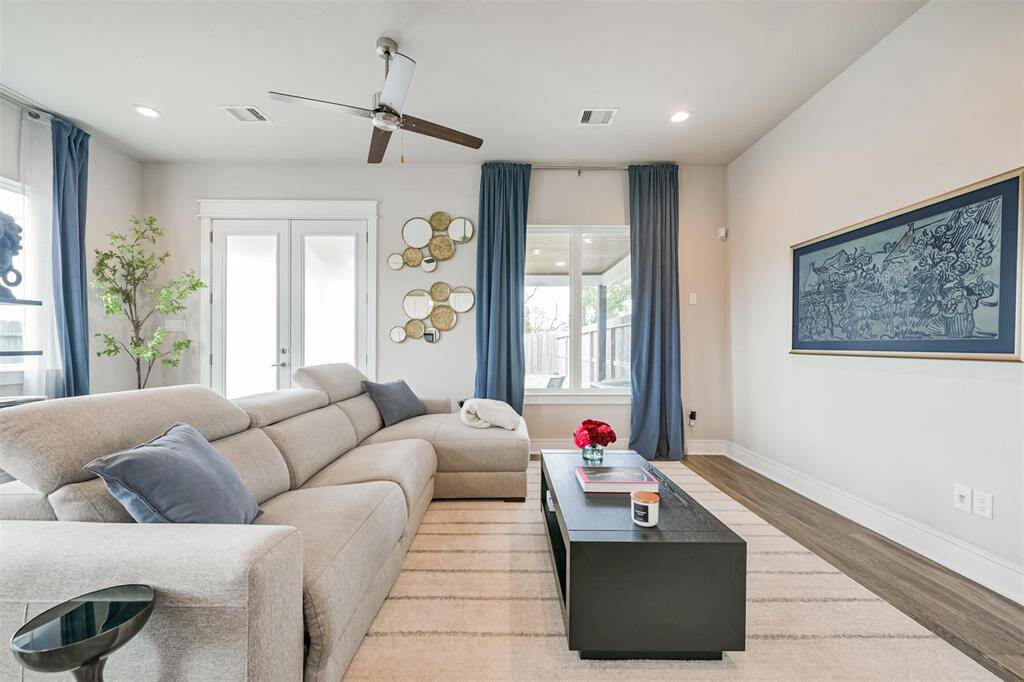 Ample natural lighting in an open, airy space with a neutral color palette, offering a cozy yet stylish atmosphere.