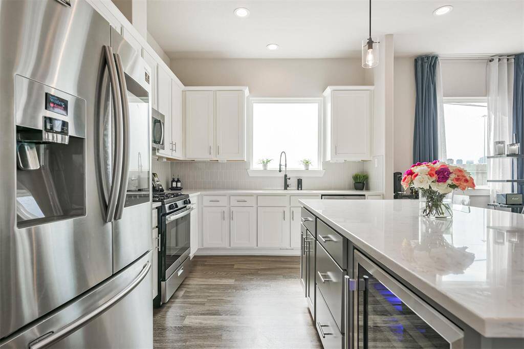 Sleek white cabinets add a touch of elegance in this space.